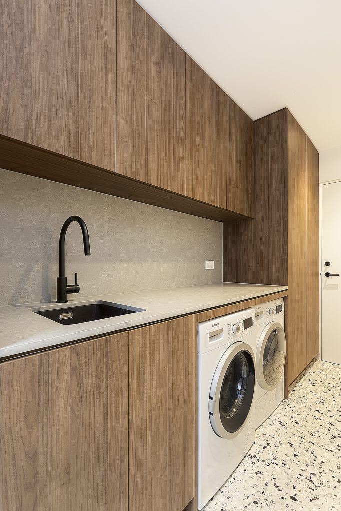 Polytec Woodmatt laundry with a Quantum Quartz Concrete Matt stone top and splashback - Concord, Sydney